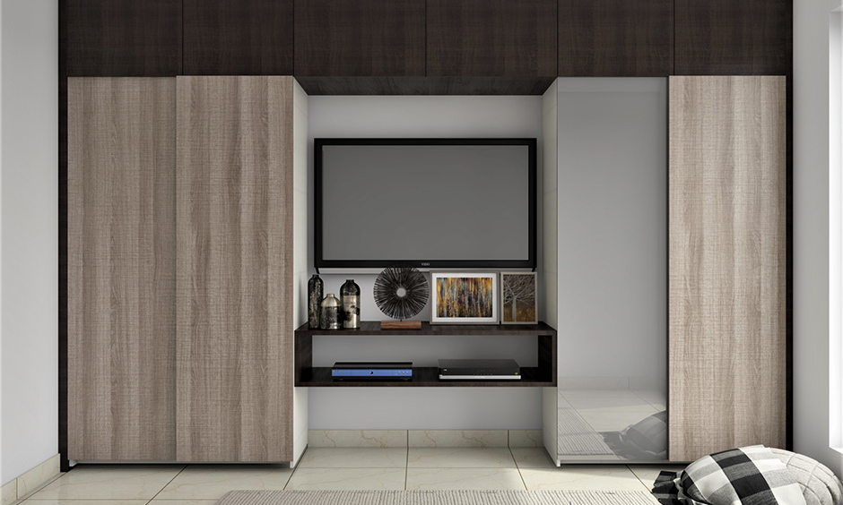 Wall wardrobe integrated tv cabinet design looks sleek and compact is the wall wardrobe design for small bedroom.