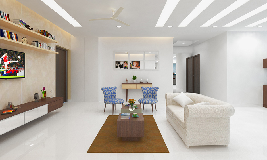 White is an Indian summer paint color for an open living room with classic furniture brings a pristine and clean look.