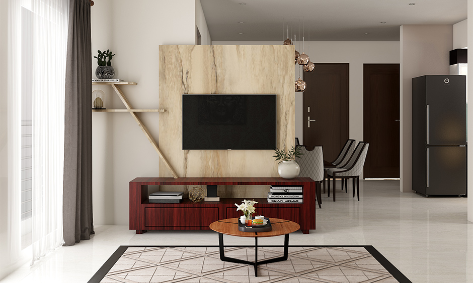 Wooden tv showcase design for hall in a light colour and double up as a partition between living and dining area.