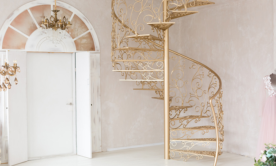 Spiral staircase design idea, artistic metal spiral staircase design in gold colour adds a vintage vibe to the house.