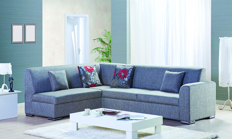 Blue colour themed living room design with a blue fabric corner sofa