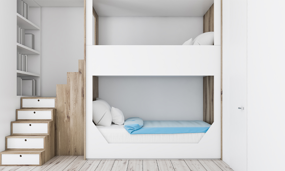 A double-decker space saving bunk bed for kids with stairs and hidden storage is the best space-saving design.