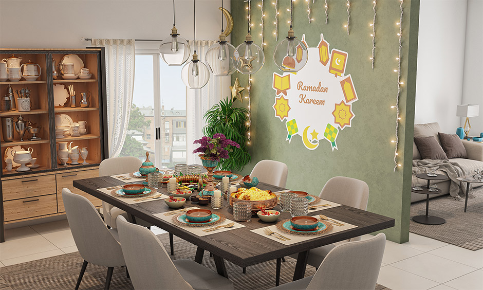 Eid Milad un nabi decoration for dining table with traditional metal pottery, candles and flowers bring festive feel.