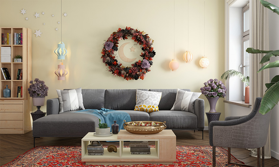 Living room walls decorated with fresh flowers and hanging lights are the aesthetic Eid decoration ideas for home.