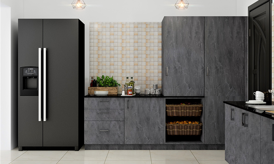 Industrial style kitchen cabinets in grey colour with glossy floor tiles and pendant lights lend a luxurious touch.