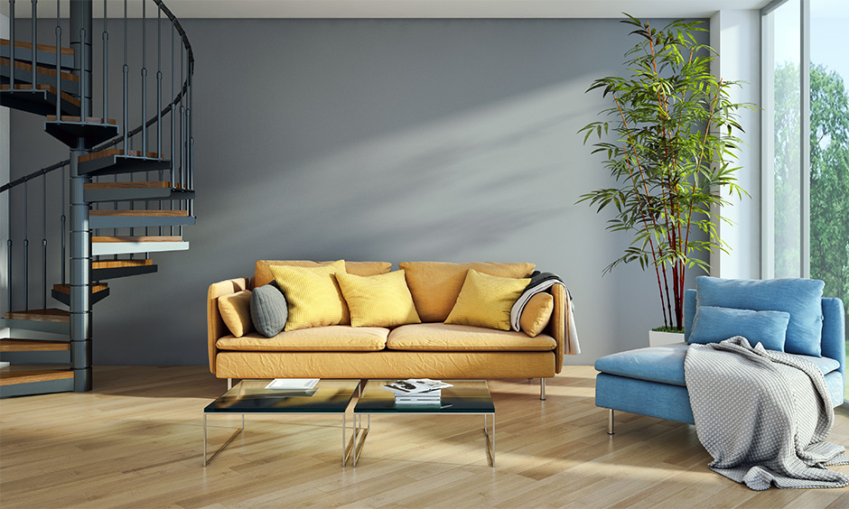 Minimal living room with stair layout in a spiral with handrail detailing and wooden steps lends a rustic vibe.