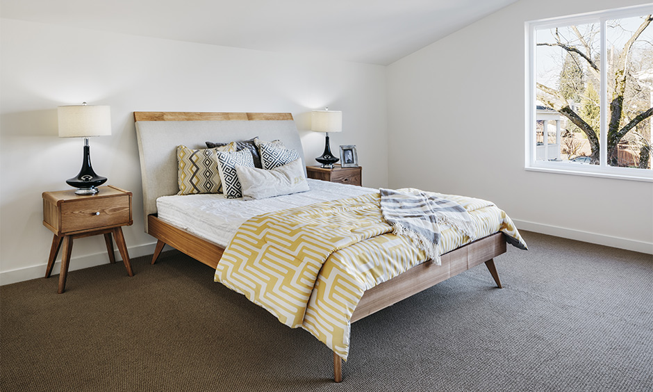 Mid-century modern interior design for bedroom in white colour with minimal furniture looks spacious and airy.