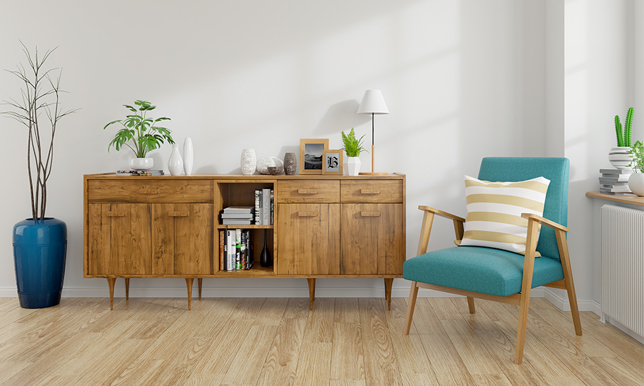 Mid-century modern interior design living room in white colour with blue accent armchair look aesthetically clean design.