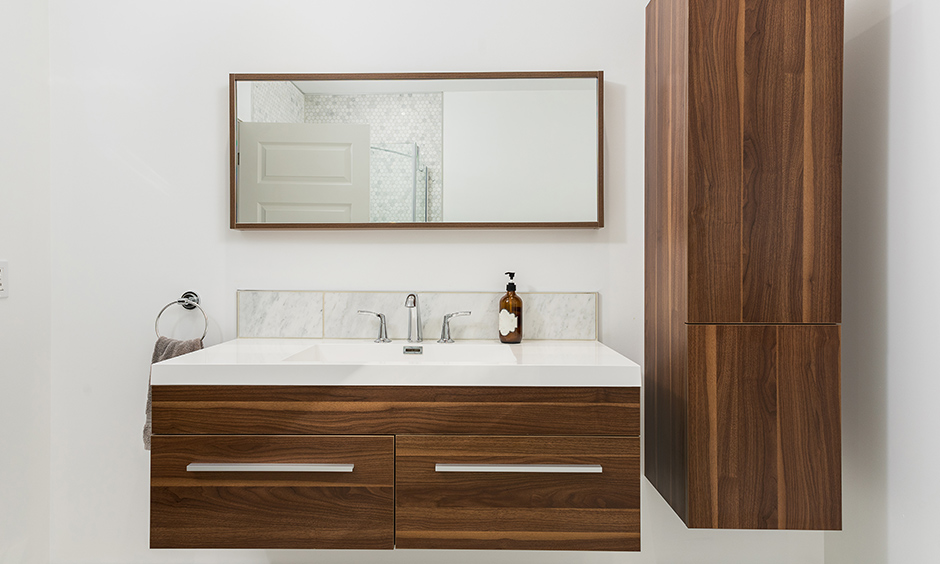 Floating vanity design for small bathroom with a rectangular mirror and a medicine cabinet look minimalistic.