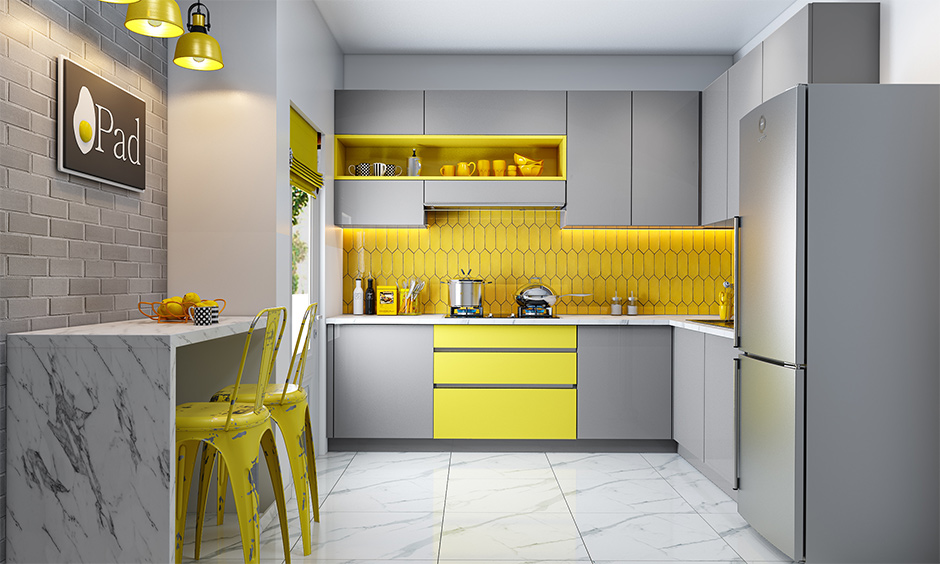 Modern Indian kitchen interior designed with breakfast counter in Pantone colour of the year lends a chic look.