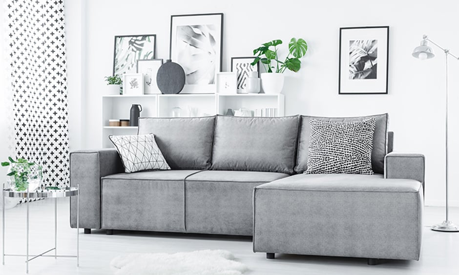 Modern living room design with a compact corner sofa in grey