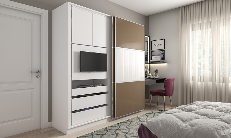 Sliding wardrobe with a built-in tv unit is multi-use furniture for the bedroom, giving a clutter-free design.