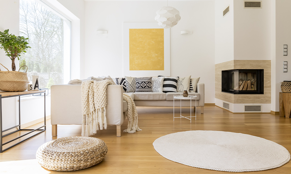 Scandinavian living room design with wooden flooring and minimal wooden furniture adds warmth to the style of interior.