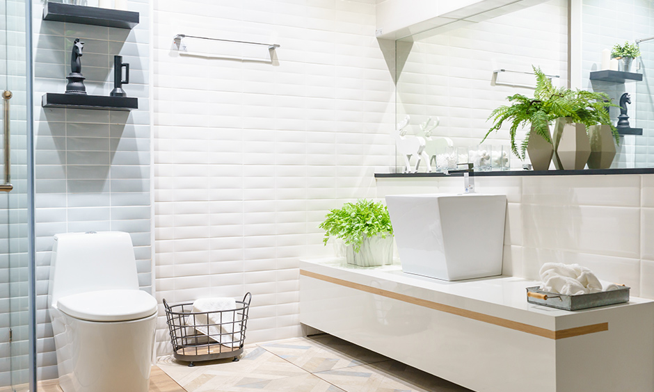 Spa-inspired white bathroom vanity design with a seating option lends a chic look.