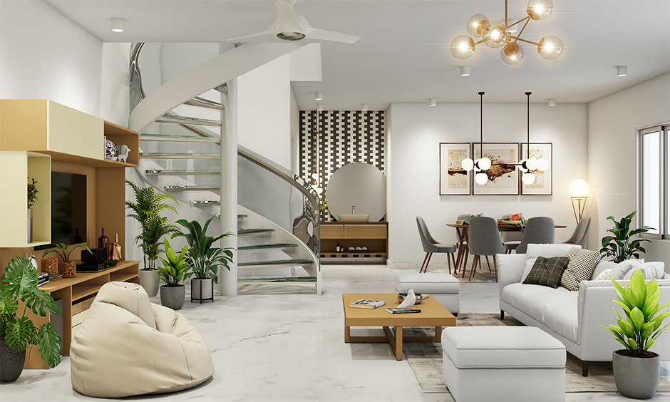 Staircase spiral designed in glass gives a delicately stylish look to the living room cum dining area.