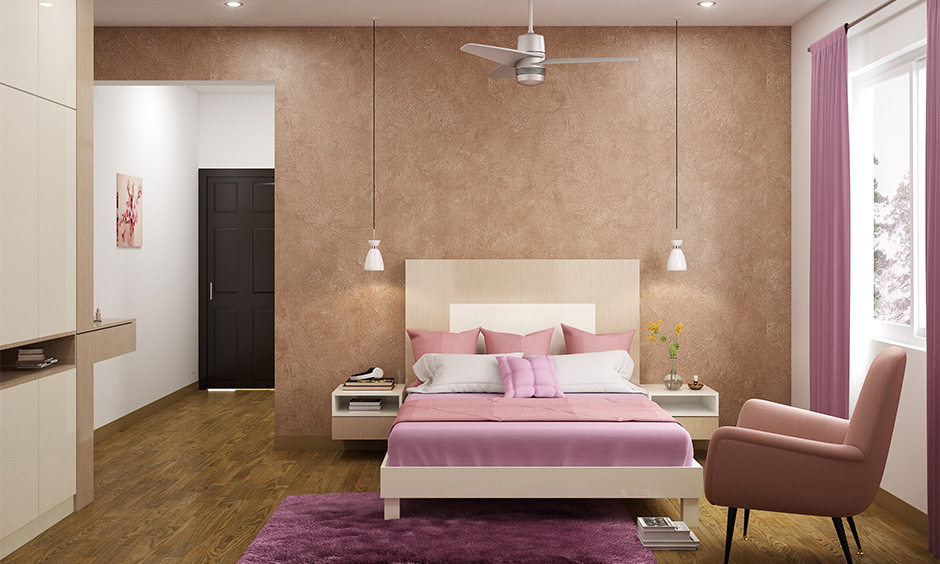 Wall paint colour for the guest room in textured peach with white accent enhances the room’s appeal.