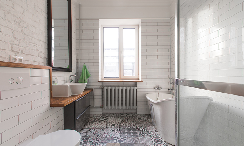 Monochrome white bathroom in minimalist home design with a mix of tile and brick cladding wall adds character.