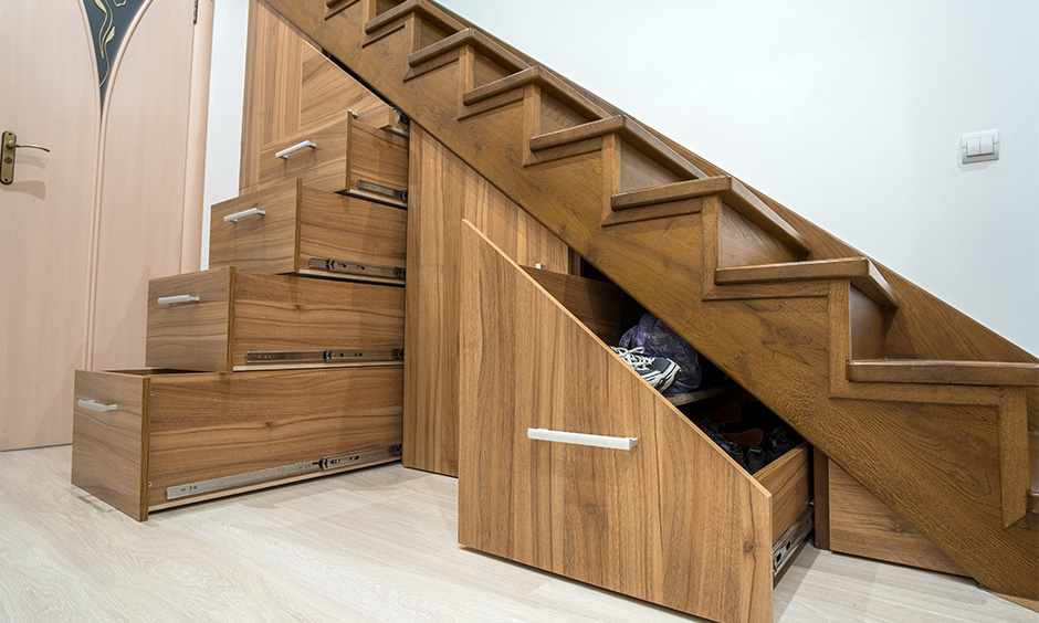 Multipurpose furniture wooden staircase with a hidden storage design for the small home creates extra storage.