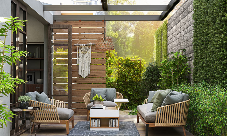 Backyard living room designs for your home with a mix of an artificial green wall and a fenced wall