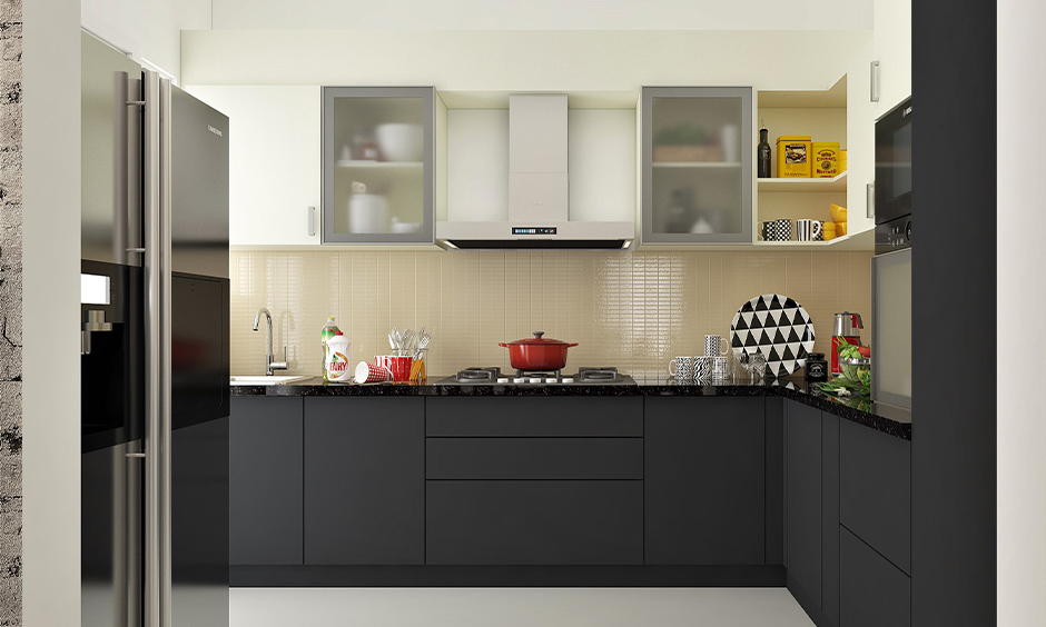 L-shaped Kitchen accent colours in blackish grey base cabinets and white wall cabinets lend some subtleness and warmth.