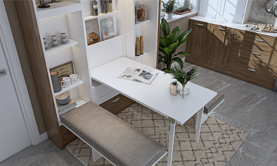 Drop-down space saving dining table for 4 with a pull-down dining bench creates an uncluttered dinner space.