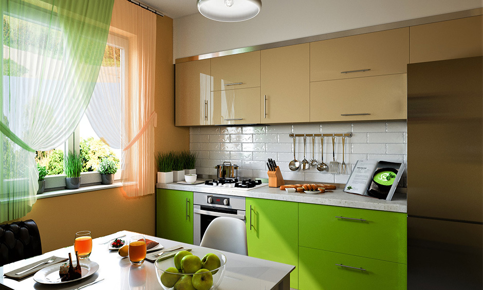 Small kitchen accent colours in green base cabinets and cream wall cabinets lend a countryside farmhouse vibe.