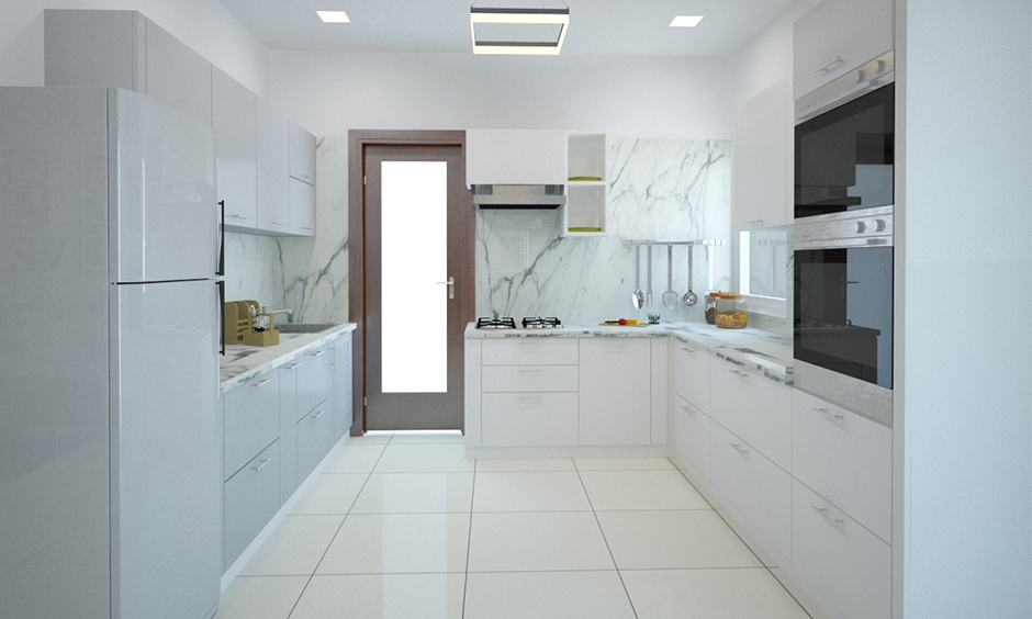 White Italian modern kitchen designed in u-shape with appliances and gadgets looks sleek.