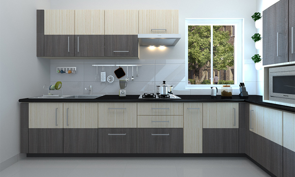 L-shaped Italian style kitchen with a large window makes the kitchen look spacious and bright.