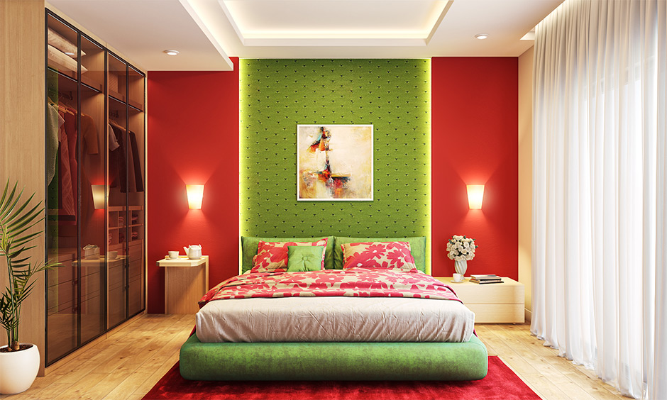 Green and red bedroom wall in vibrant combination with minimal furniture and light look bright.