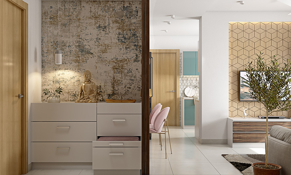 A modern foyer designed with a storage unit and textured wallpaper lends an elegant look to space.