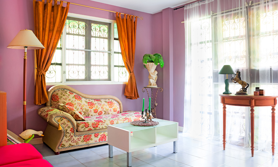 Traditional living room has a purple wall color combination with an orange accent curtain and floor lamp.