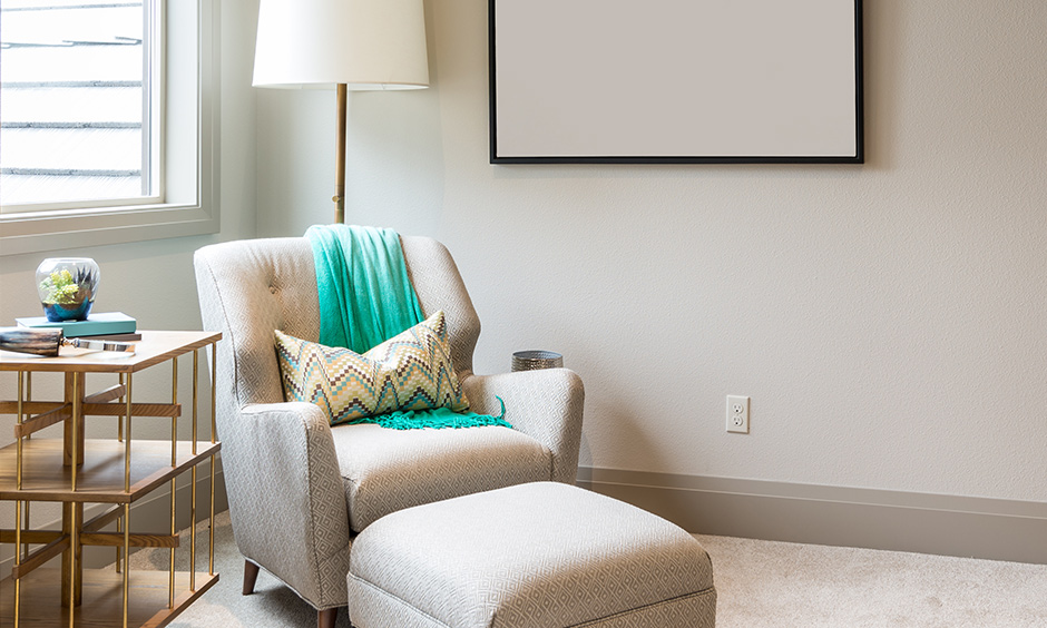 A cozy chair with an ottoman can be the perfect addition to your room