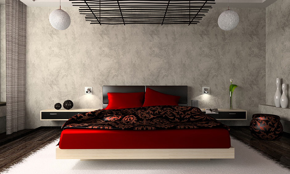 A red and black bedroom with a grey wallpaper design lends a classic and bold look.