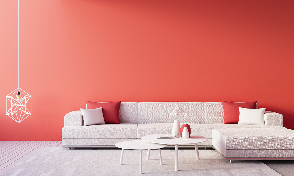 Red wall paint combinations with white sofa and coffee table look bright and serene.