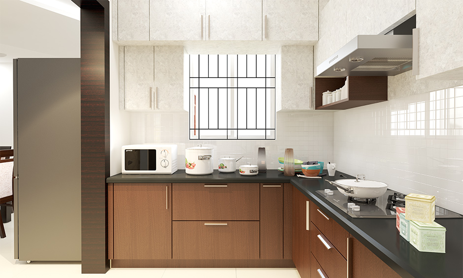 Small Italian kitchen designed in l-shape with wooden cabinets brings a traditional vibe to space.