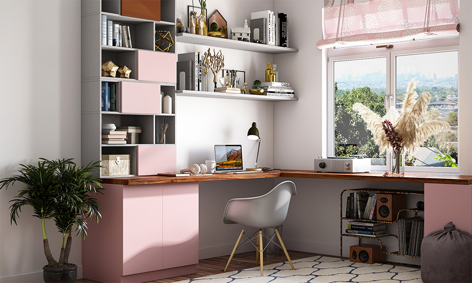 Study room for teenage girls designed in pink accent and l-shaped desk lends a gorgeous look.