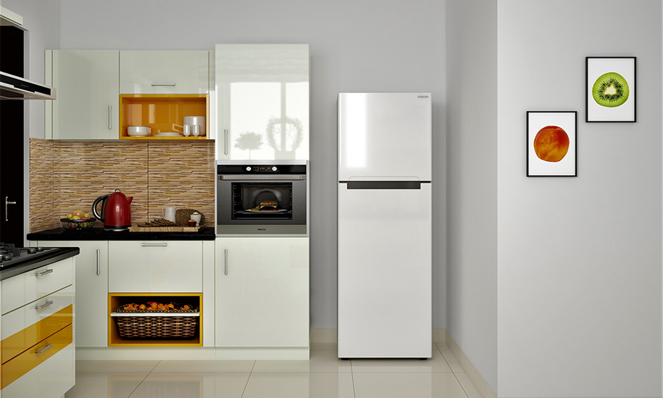 Cabinets in the white and yellow kitchen accent colour bring a bold look to the small kitchen.