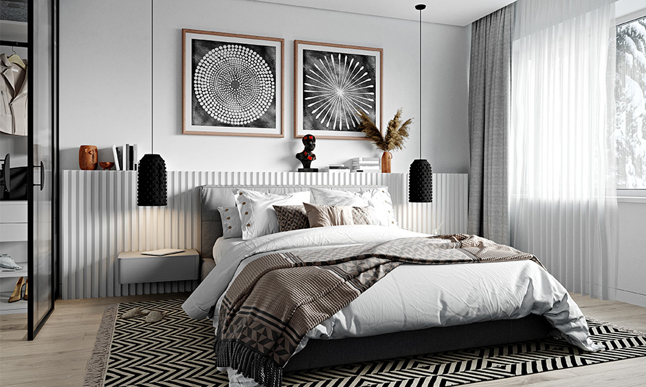 The bedroom has an African tribal decor artwork on the wall in monochrome lends a clean and classy look.