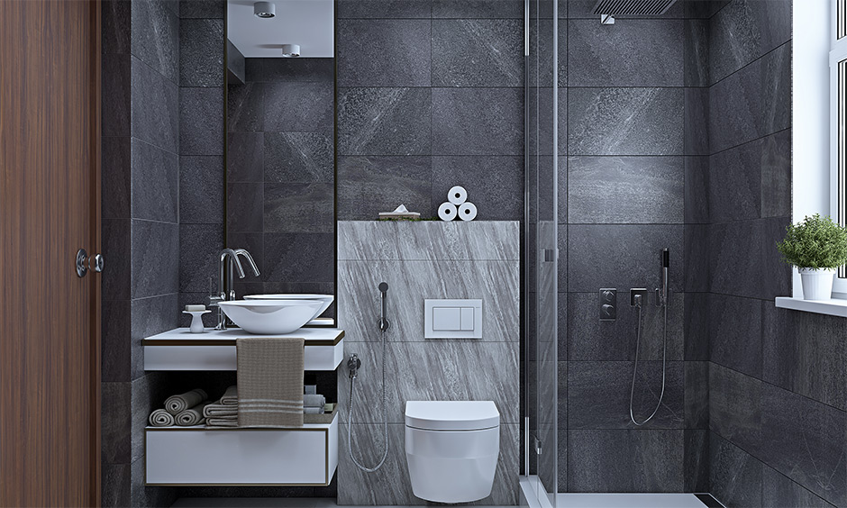 Bathroom tiles in black and white house interior with floating vanity unit in white looks refreshing.