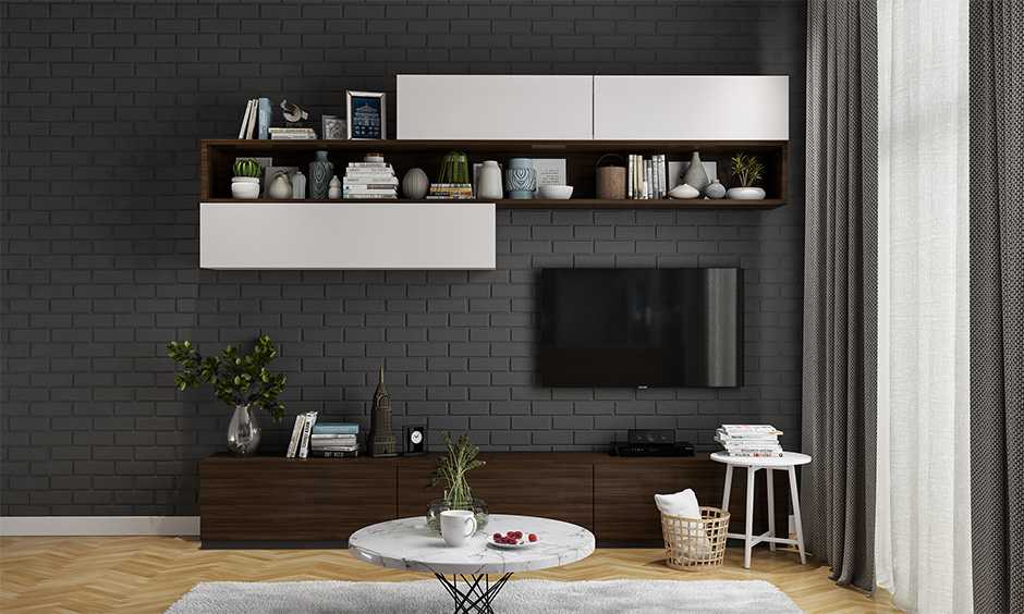 Brick-style wall in a black and white painted living room looks elegant.