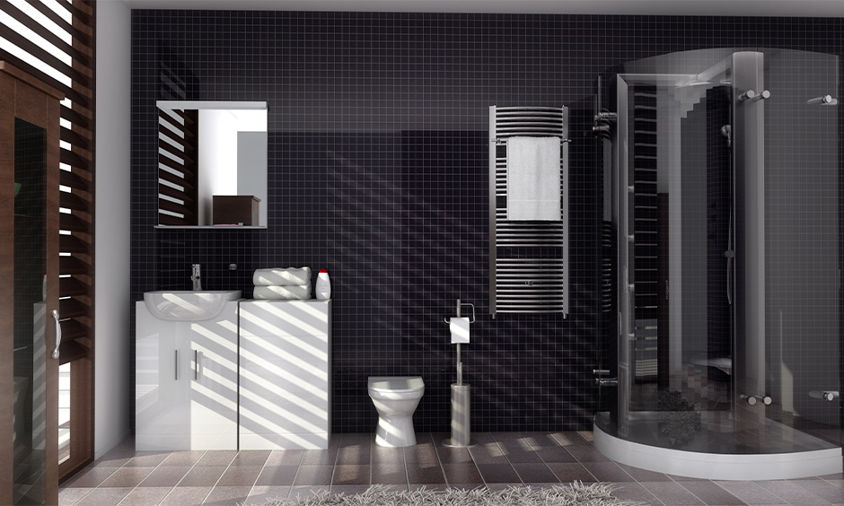 Dark bathroom interior design in deep purple colour tiles lends a sleek look for space.