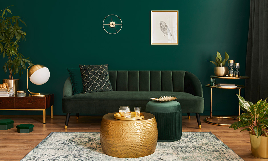 Living room in dark theme interior in green creates a cosy dark interior for home.