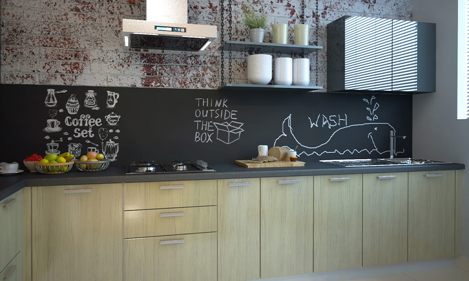 Chalkboard backsplash design in Indian kitchen adds a chic look and brings in a fun element to space.