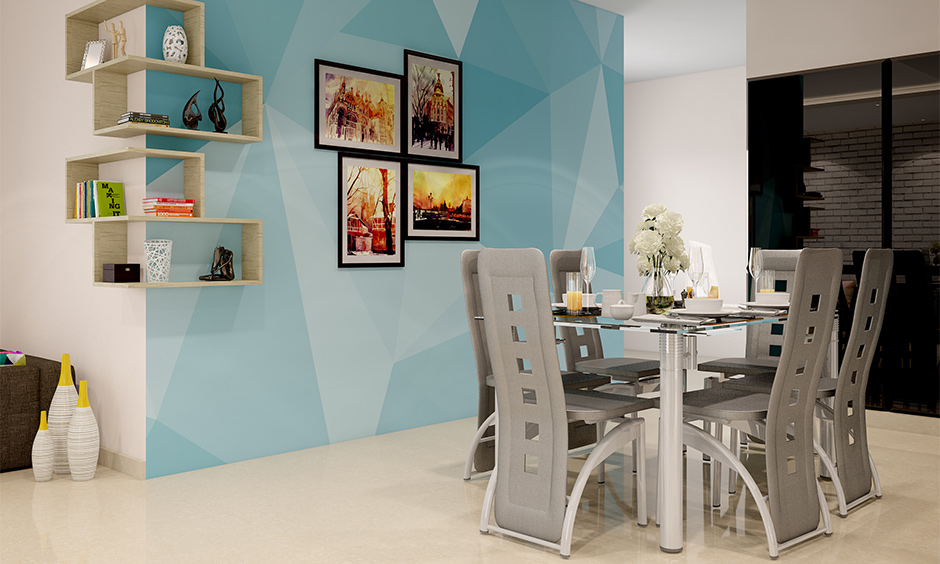 A grey dining room table and chairs in a metallic finish give the space a futuristic look.