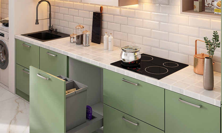 The kitchen white tile countertop looks minimal and classic with matching tiles for the backsplash.