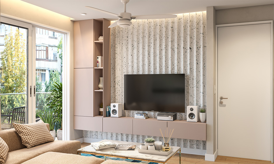 Modular wall mounted tv cabinet in pink laminate with open shelves lends an elegant look.