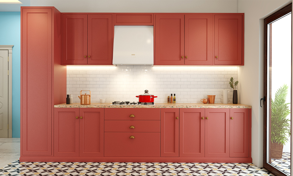 Simple Indian kitchen design with skirting drawers, pantry pull-outs, and fancy hooks is clutter-free storage.