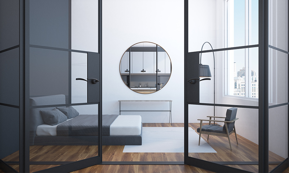 Glass bedroom door in sleek and minimal design and helps in maintaining the look of space.