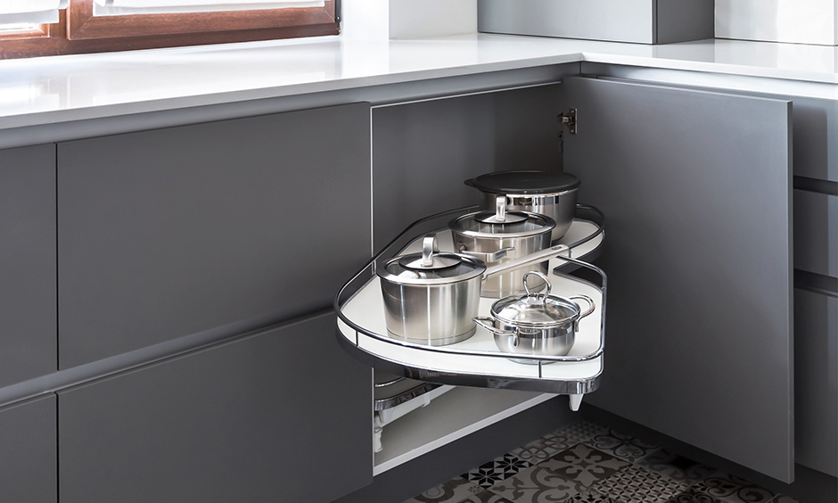 Pull-out blind corner kitchen cabinet storage creates more room in the area and lends a sleek look.