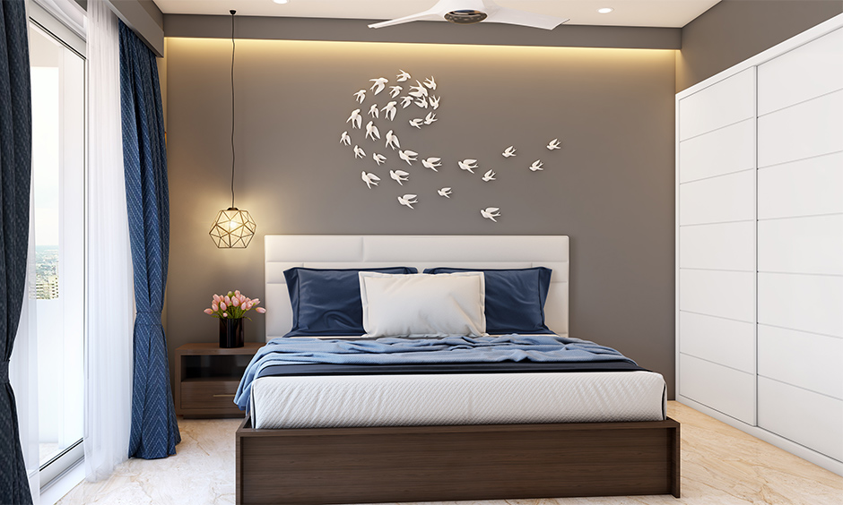 The blue-grey two colour combination for bedroom walls gives an elegant look to space.